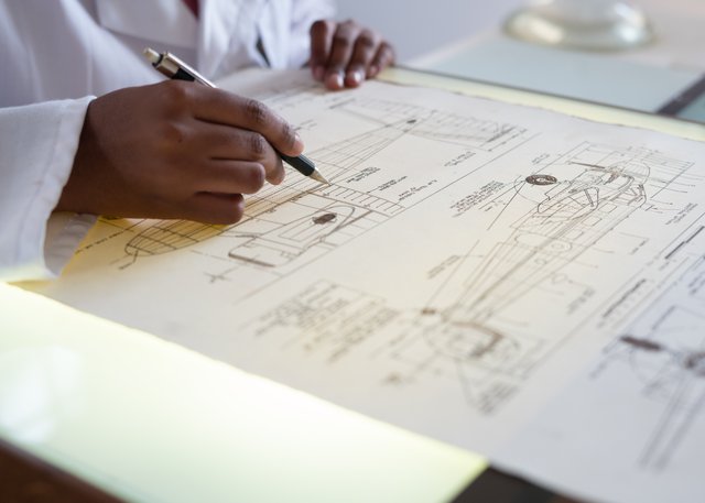 a person studying blueprints